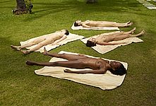 Nude girls lying on the grass